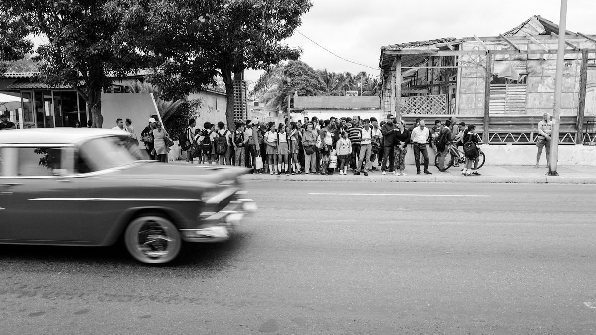 Leica Q2 #ThroughYourLeica This is one of my favourite images that I have ever taken, love the car movement and all the people waiting for the bus for different reasons 

#blackandwhitephotography #BlackAndWhite  #Leica #LeicaCamera #photography #28mm #Cuba