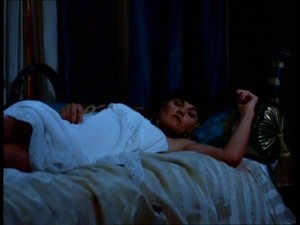 She settles in bed closing her eyes~