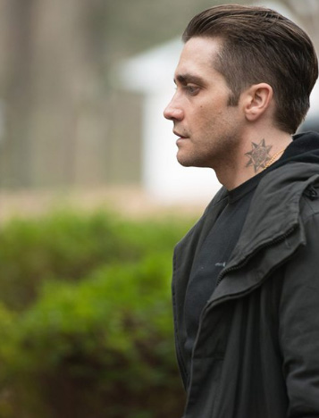 Guys I need help on figuring out whats in the middle of detective lokis neck  tattoo In my vision looks like a wolf or a coyote  rjakegyllenhaal