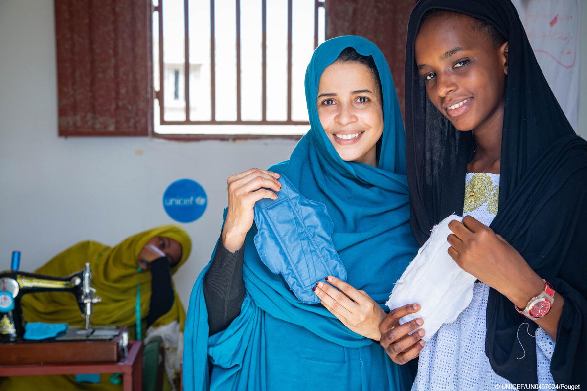 UNICEF's tweet photo. Menstrual products must be accessible for all menstruating persons. PERIOD. 

Aichetou, 25, and Hajr, 16, show us the sanitary pads they made themselves at a UNICEF-supported activity centre in Mauritania. #MHDay2022 https://t.co/0u9iROBIM4
