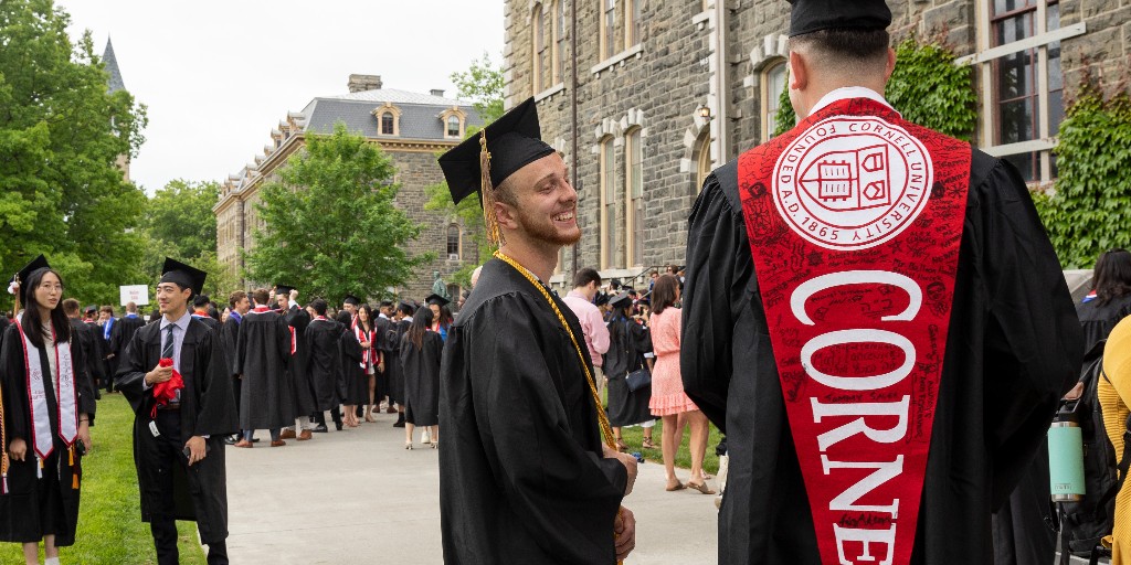 CornellDyson's tweet photo. A great day for Cornell's Charles H Dyson School of Applied Economics and Management graduates! They, along with faculty and administrators, joined in the fun of the Cornell Commencement Procession today. #Cornell2022 #CornellGrad https://t.co/jsQK6BVjxM