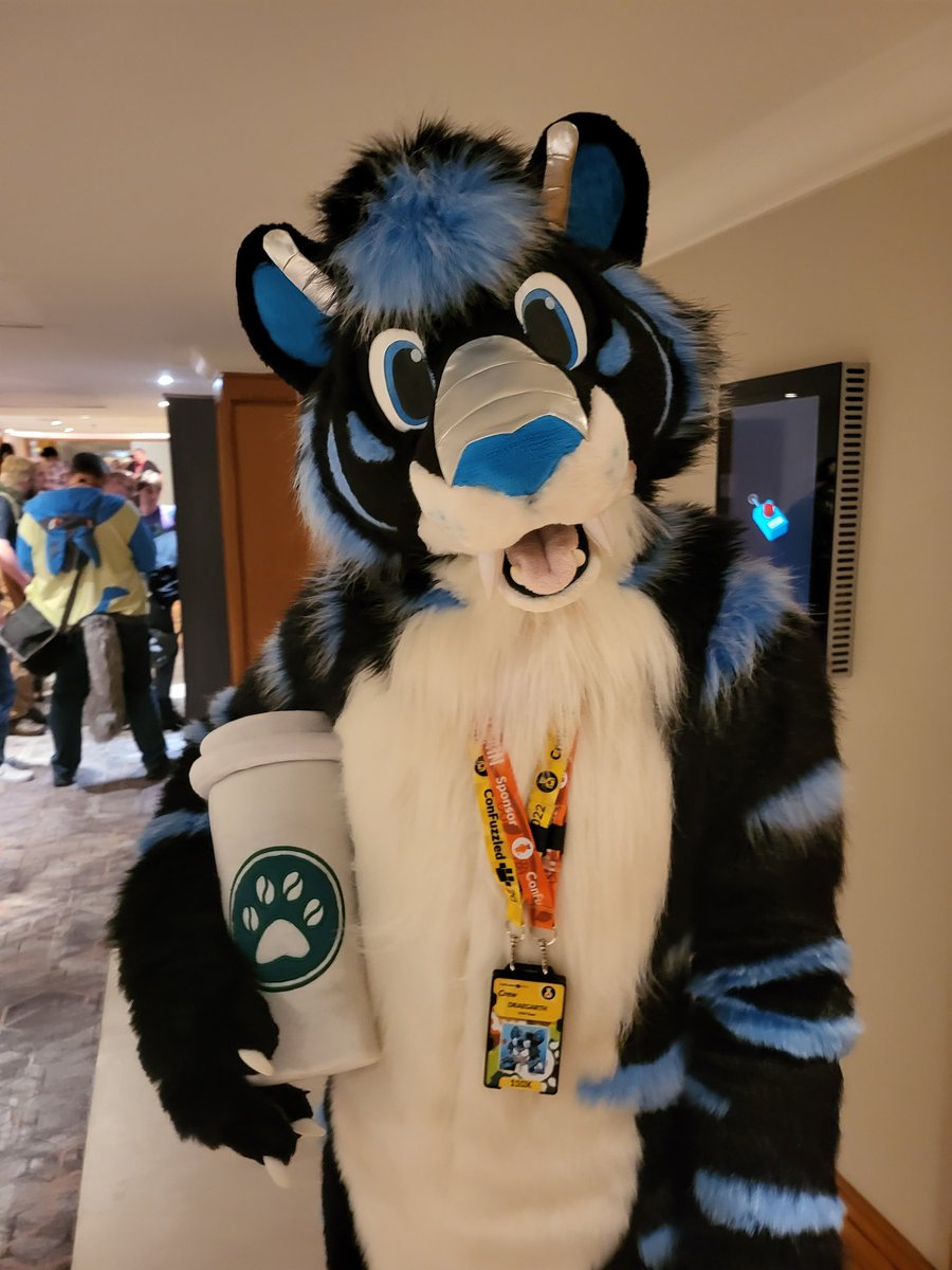 KirkzerWright's tweet photo. He sure loves he's pawsome coffee! @Draegarth #confuzzled2022 https://t.co/ld7CXtfU72