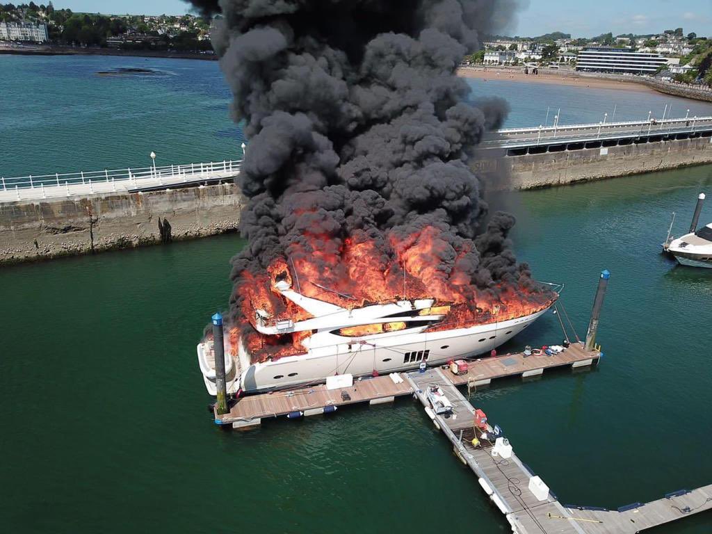 SouthDevon_SC's tweet photo. Currently on scene with the large incident at #Torquay harbour. A #Jessip multi agency response. The vessel has now been extinguished, however it has now sunk below the surface of the water. https://t.co/jNlFp5BkqB