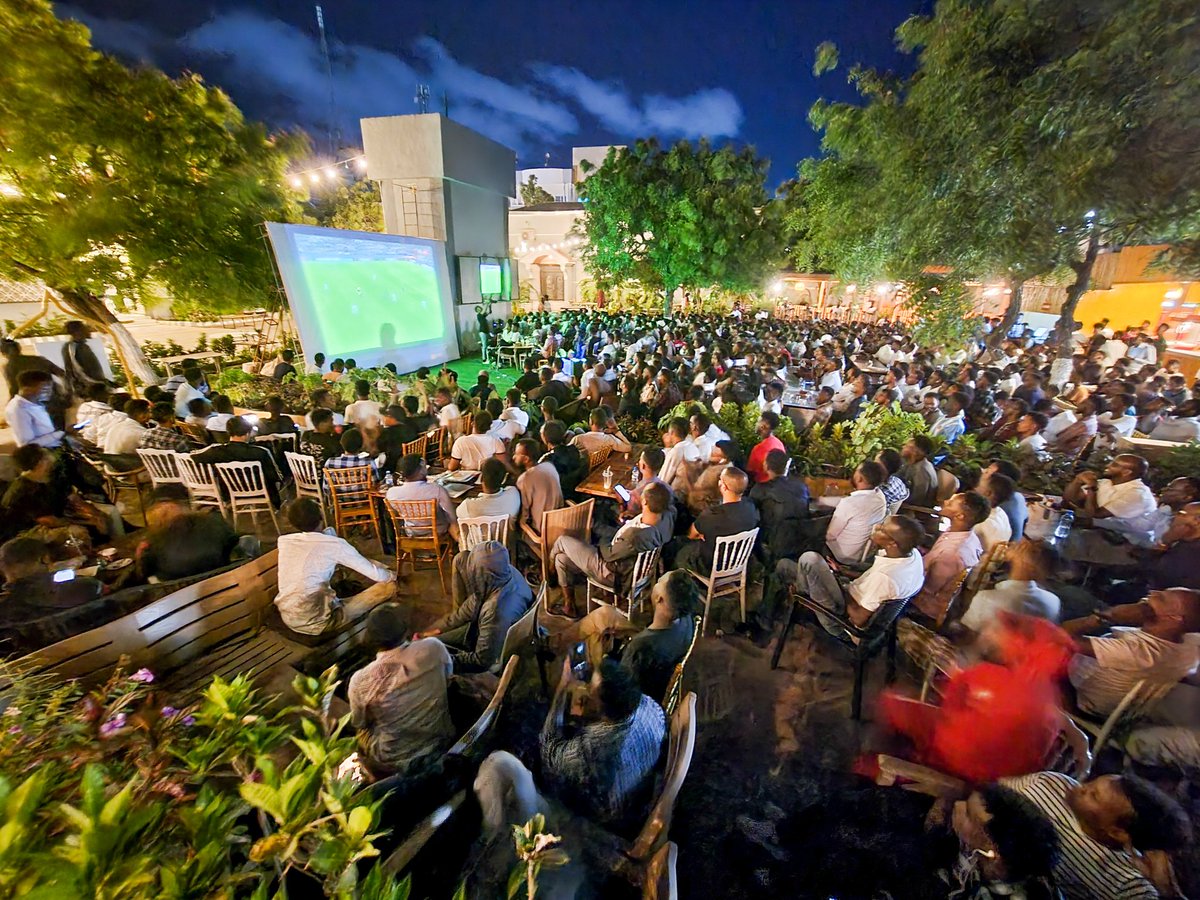 Abdishukrihaybe's tweet photo. A rare scene in #Somalia!
Football enthusiasts in Mogadishu, Somalia, watch the #UEFAChampionsLeagueFINAL match between #LiverpoolVsRealMadrid on a large screen at a local cafeteria- Rio Palace. https://t.co/zOzV9JdceP
