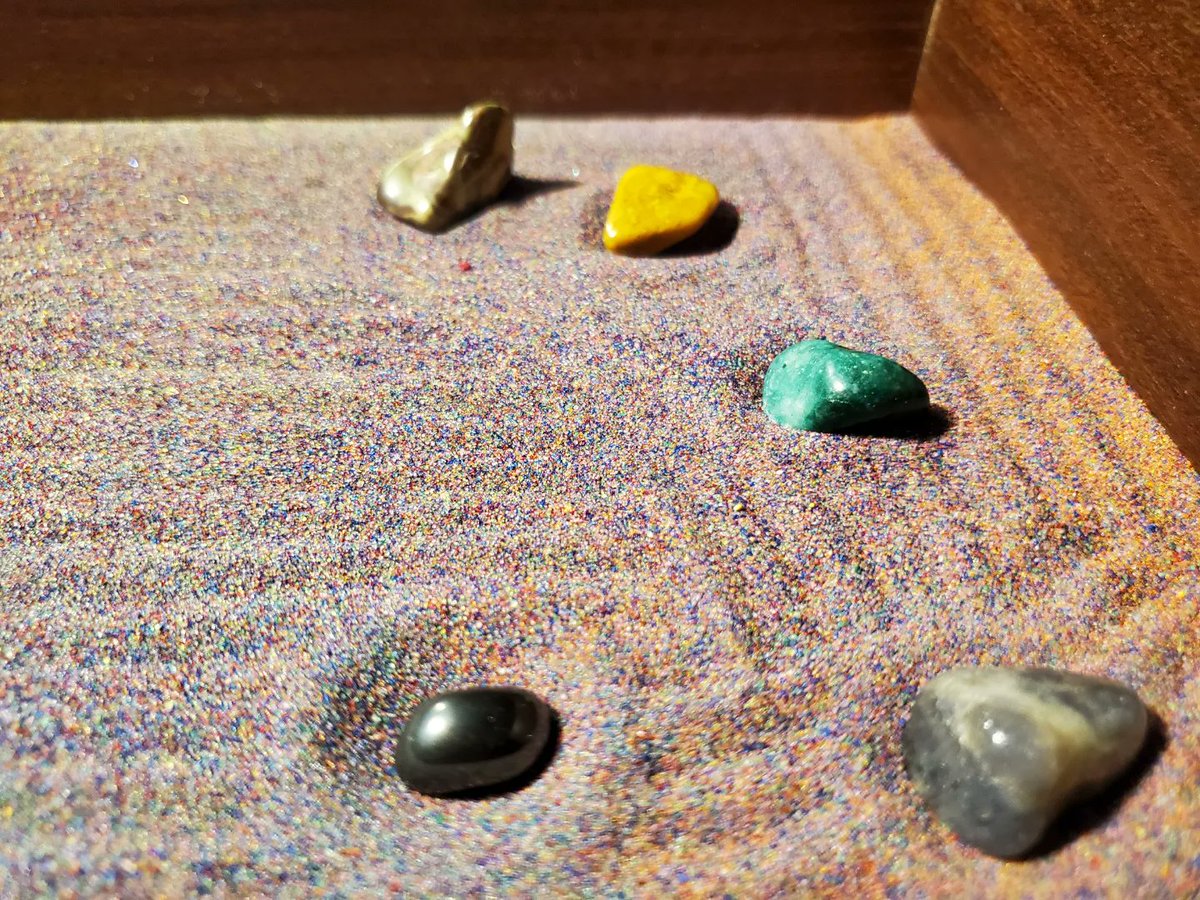 Hopegiver's tweet photo. Here's my first attempt at a personal zen garden. I'm using a large shadow box, colored craft sand and various precious stones.

#zengarden 
#craftsand 
#preciousstones 
#zenlife 
#peacefuleasyfeeling https://t.co/IdykdqR7dR