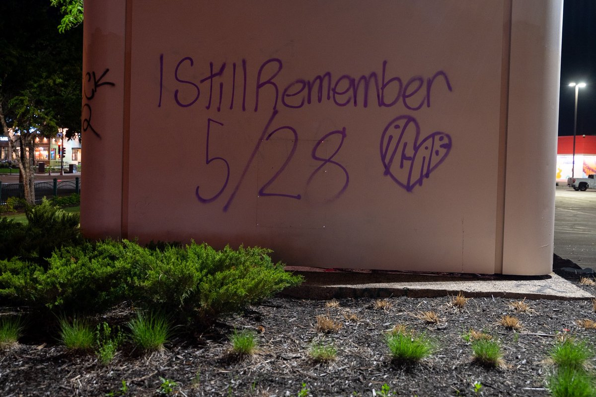 daviss's tweet photo. Protesters marched with a banner reading “Remember May 28th” to the third precinct tonight where fireworks were sent up and shopping carts were set on fire before moving on. https://t.co/JCOqaVGNSt