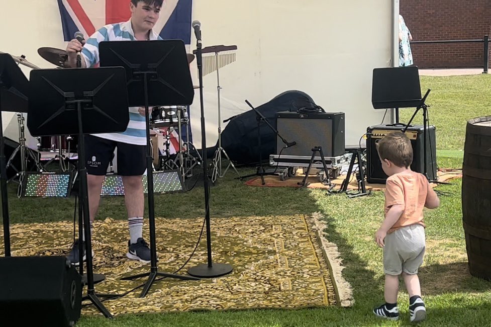 GreenRosina's tweet photo. We have another #stageykid in the family! Freddie loved being entertained at the music tent yesterday at Founders Day but thought big cousin Ed was the best of course! 😂😂
#crashthestage #minirockstar
@EpsomCMusic https://t.co/4FV476I09B