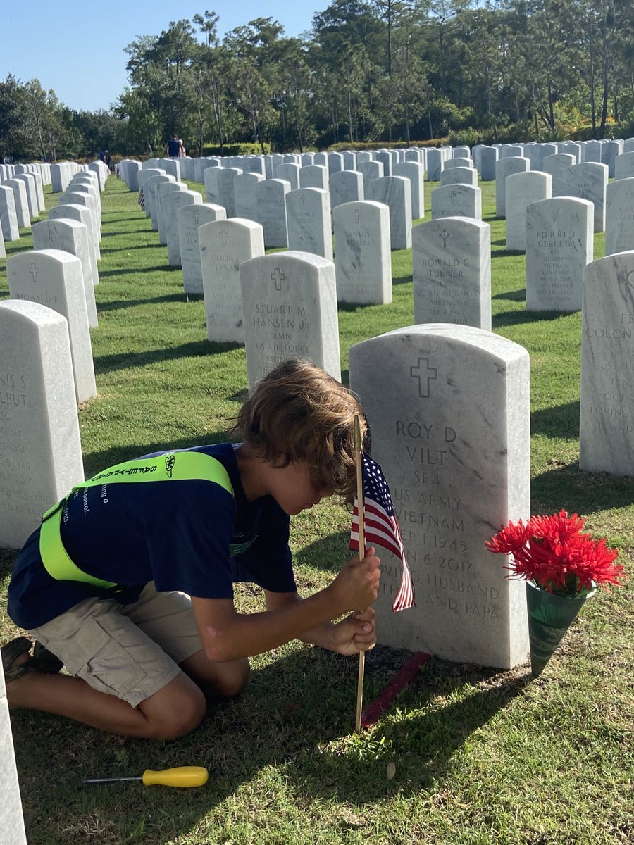 Golden Grove Safety Patrols participate in placing flags at the Florida National Cemetery for Memorial Day.