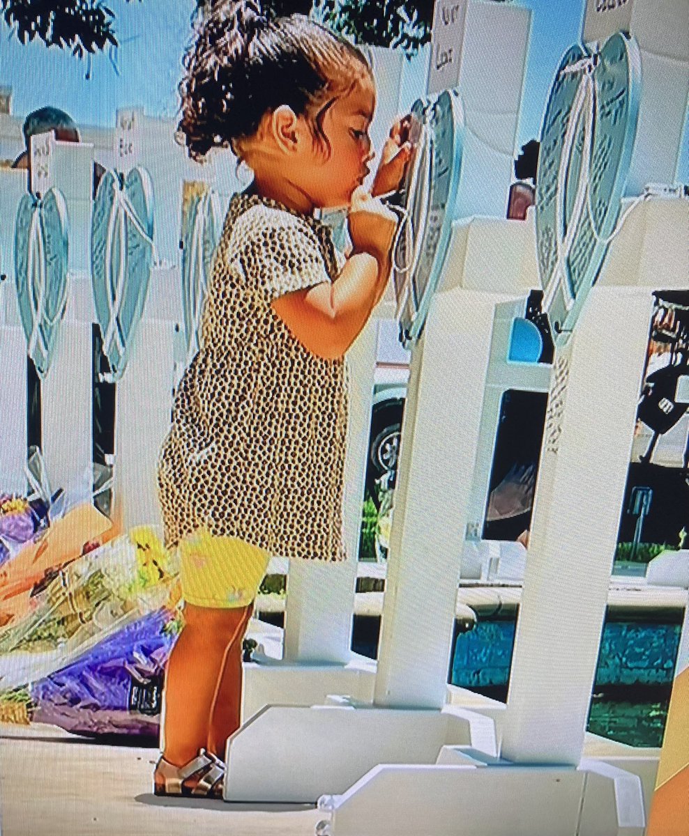 lkmena's tweet photo. To: “Through My Eyes”
PHOTO OF THE WEEK! 2 year old Tamara Guzman signs one of the 19 crosses representing friends &amp; acquaintances outside Robb Elementary Scool ! Could she be next? You “heartless bi—-h! Keep supporting the worst president in our nations history!” Hilary My Ass! https://t.co/vQx8yWY44t