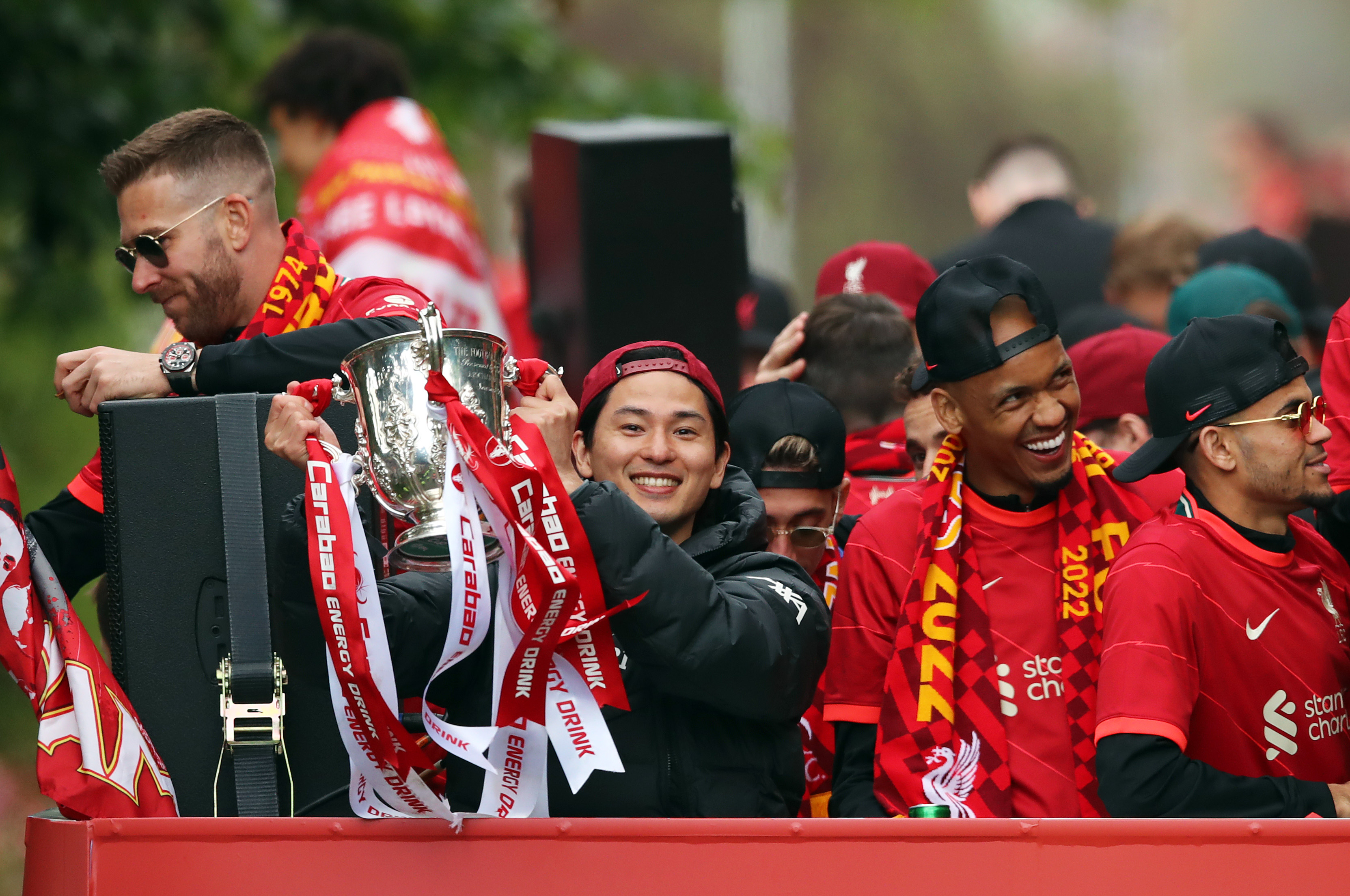 Takumi Minamino celebrates with the Carabao Cup during the Trophy Parade.