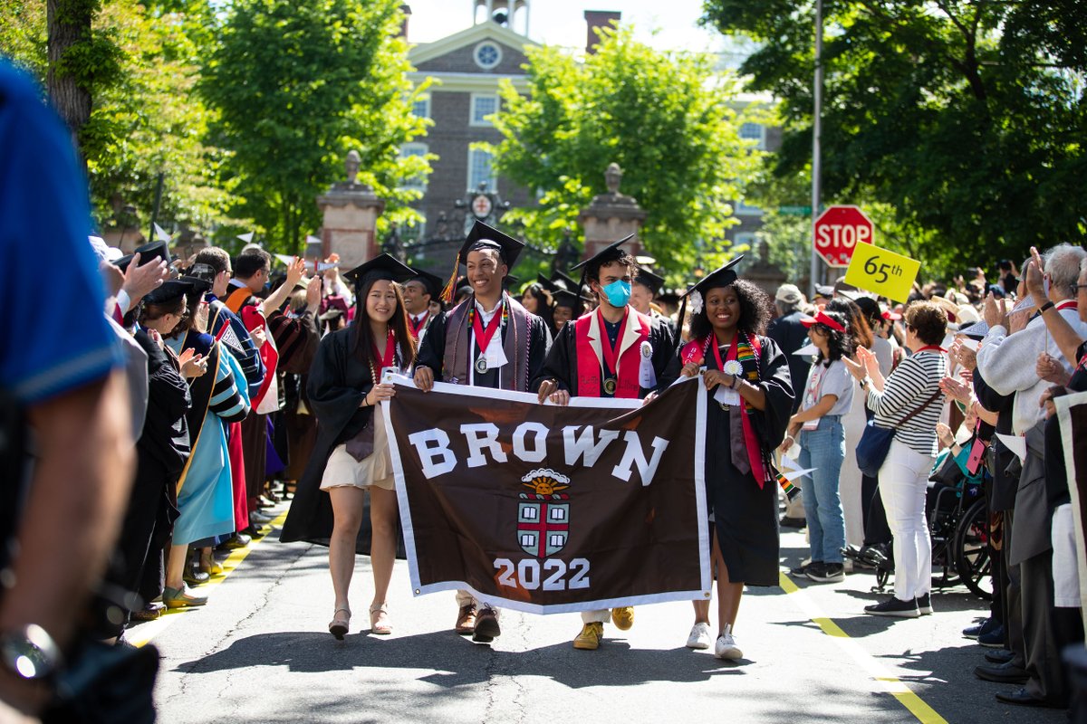 BrownUniversity's tweet photo. #Brown2022 steps through the Van Wickle Gates, cheered on by thousands of alumni, faculty and friends, during Sunday morning’s Procession — a University tradition preceding the College, Graduate School, Medical School and University Commencement ceremonies. https://t.co/D8Lwqq52tp