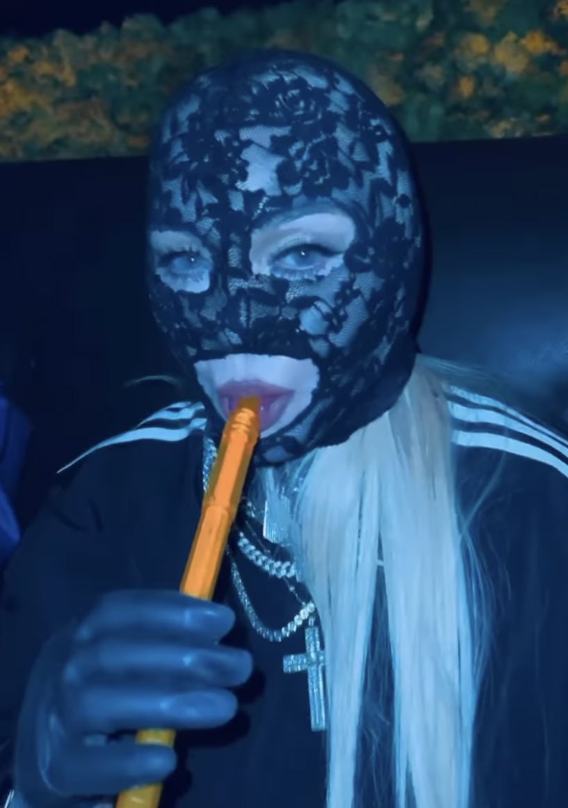 PopTingz's tweet photo. Madonna shares a new video of herself smoking hookah while wearing a black lace mask and diamond grills. https://t.co/JQM09NZiGV