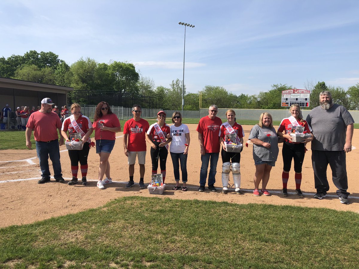 We love our seniors. Elizabeth Conkright, Taylor Grino,
Hanna Nichols and Macie Shirk with their parents on Senior Night Tuesday