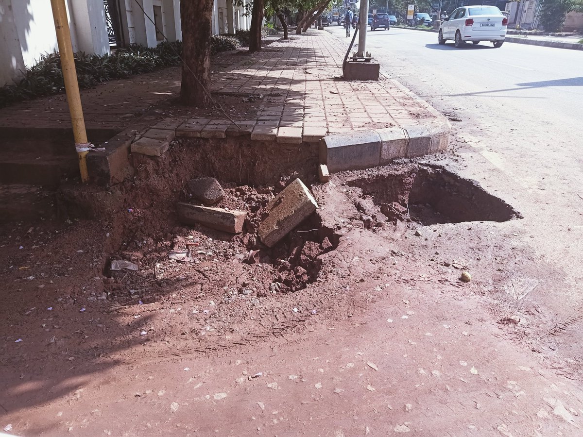 GunzVir's tweet photo. @BBMPAdmn please immediately look at this huge hole that has happened due to heavy rains . Mahadevpura zone ward 83 , whitefield main road near impressions dental clinic. https://t.co/DmImToKrpI