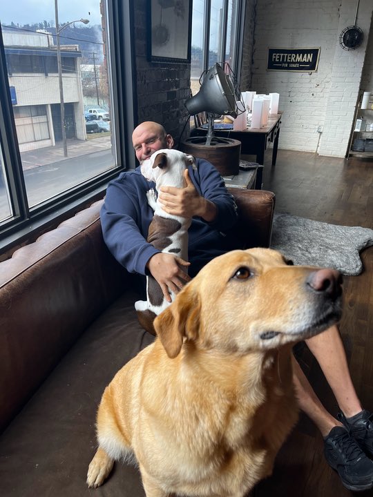 DPRK_News's tweet photo. Victorious Ferengi candidate poses with dogs in effort to convince voters that he is nearly human. https://t.co/bmds1SSCsi