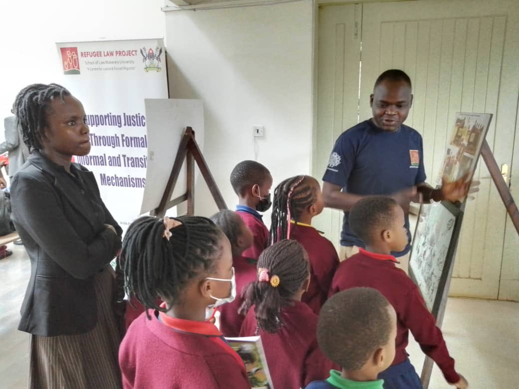 <a href="/refugeelawproj/">Refugee Law Project</a>’s <a href="/Jeryoyet/">oyet jerry</a> answering questions on conflict and peace from young visitors following their engaging with exhibition at the <a href="/ugandamuseums/">ugandamuseums</a> #IMD2022 #thepowerofmuseums