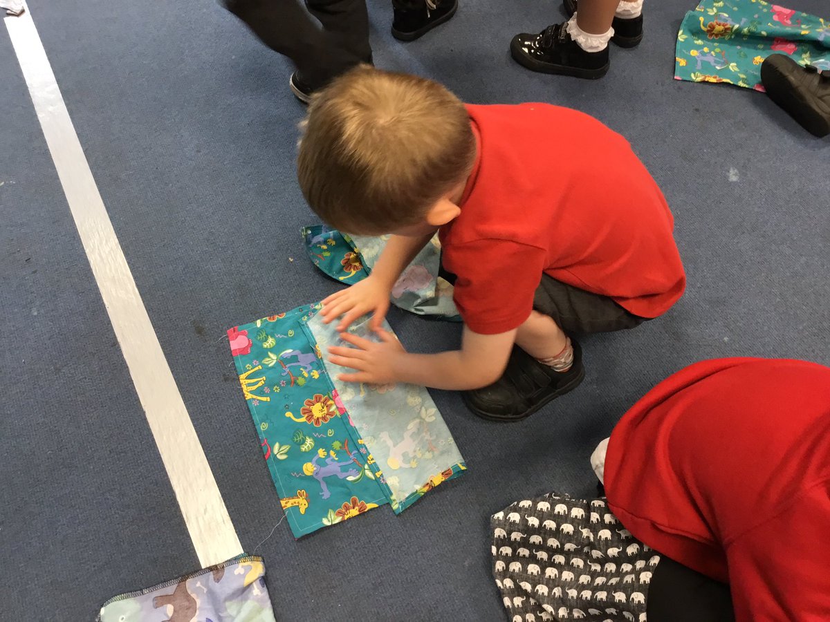 NurseryOPS's tweet photo. The children showed me the number of vehicles they were driving! Folding flappers from ‘Squiggle Wiggle’ into halves and quarters! #NationalNumeracyDay #squigglewiggle #maths https://t.co/fHlsO9mhEW