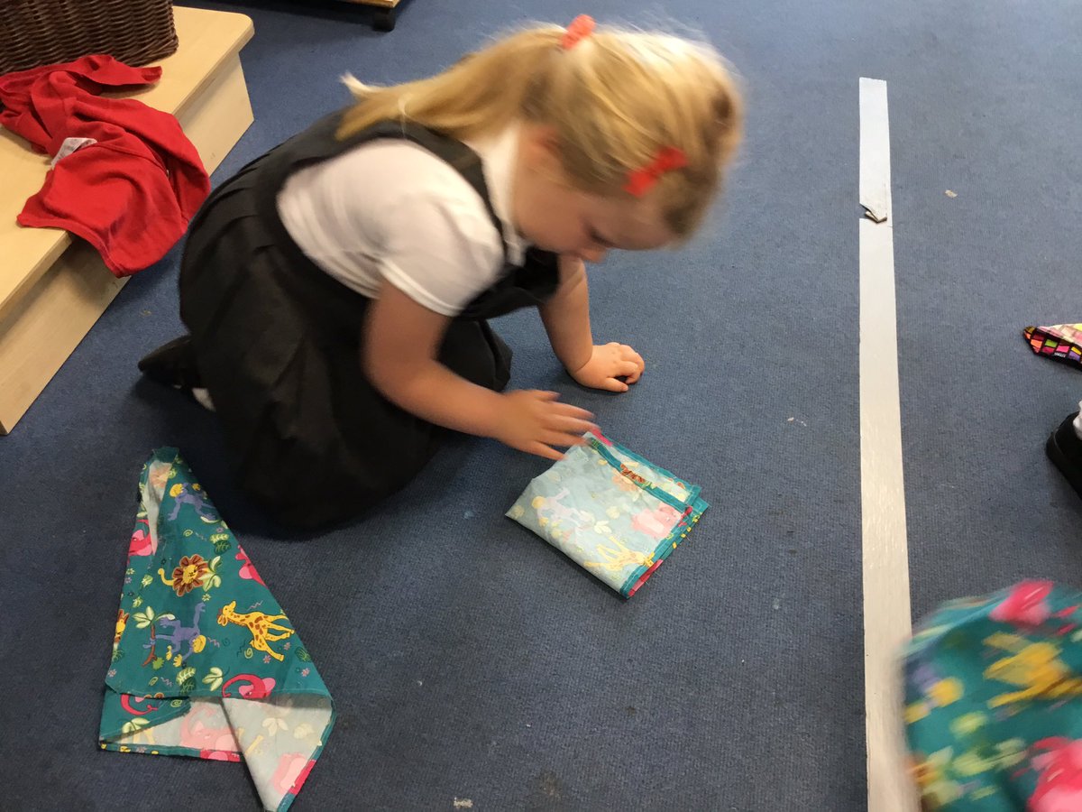 NurseryOPS's tweet photo. The children showed me the number of vehicles they were driving! Folding flappers from ‘Squiggle Wiggle’ into halves and quarters! #NationalNumeracyDay #squigglewiggle #maths https://t.co/fHlsO9mhEW
