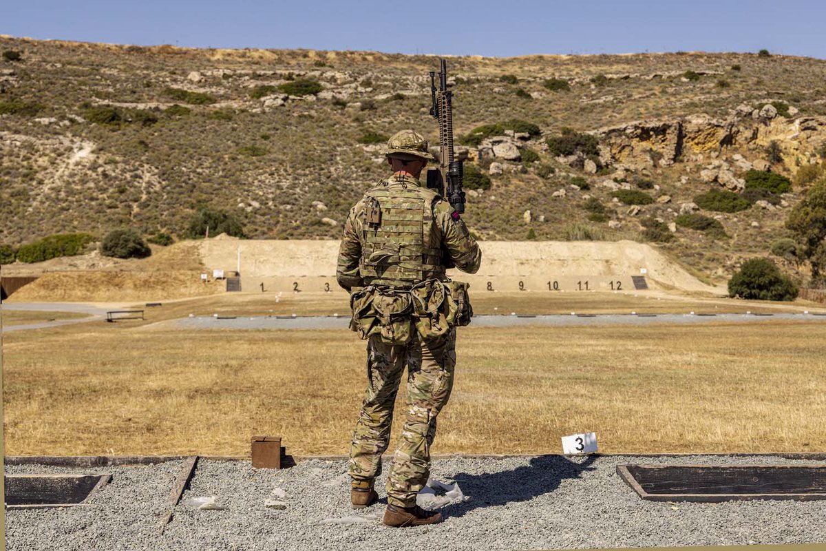 A Royal Marines Reservist stands at the top of a range in Cyprus during the exercises