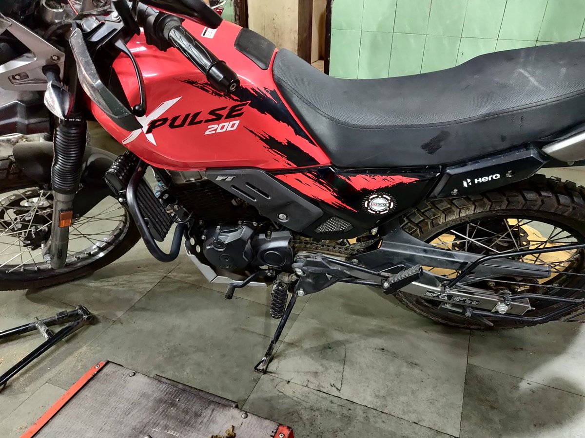 Chopra_19's tweet photo. @HeroMotoCorp Wanted to raise concern about the quality of XPulse bs6. Bought this bike last year and recently got the main stand installed from Sapphire Hero Okhla.
Shockingly! the chasis rod where the stand rests, got bent. Doubting its purpose as an adventure bike. What to do? https://t.co/wyOPlr1qoW