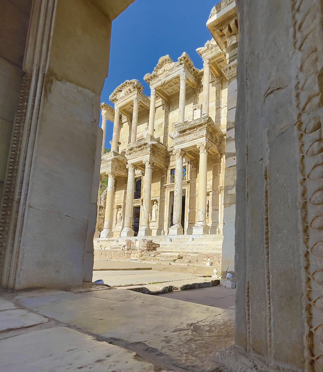 HistTreasure's tweet photo. The Library of Celsus is one of the most famous and well known sites to see at Ephesus, and for good reason. As the sun rises and light hits the stone facade, it lights up like a golden beacon amongst the ruins. #Turkey #Archaeology #History #architecture https://t.co/ttGMbjmlMW