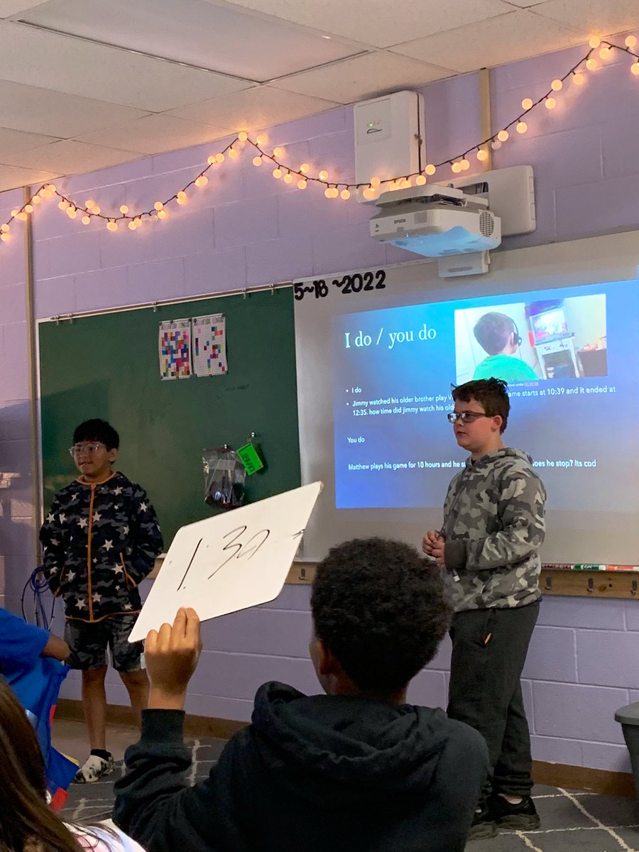 acparker12's tweet photo. Visited Mrs. Endraske’s class this morning as students taught standard based lessons from self-made PPTs on their favorite math concepts learned this year. Great class engagement and creativity 👏💙🧡👏 #TeamDCS @TweetDCS_SIS #Studentled #tellingtime #comparingfractions https://t.co/OSFg5OJlpY