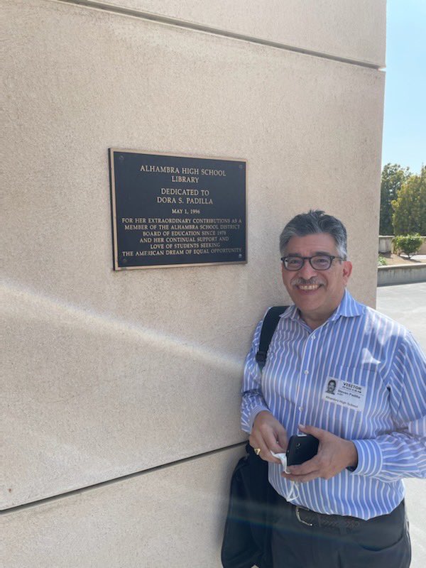 alhambrausd's tweet photo. When @latimes #ColumnOne editor extraordinaire @StevePadilla2 visited his alma mater @ALHAMBRAhigh to talk #writingtips: We caught him at plaque dedicating  #AHS Library to his mom #DoraPadilla, #AUSD Board member for 20 years! Friday the 1st scholarship in her honor is awarded. https://t.co/E3VIiWIEpR