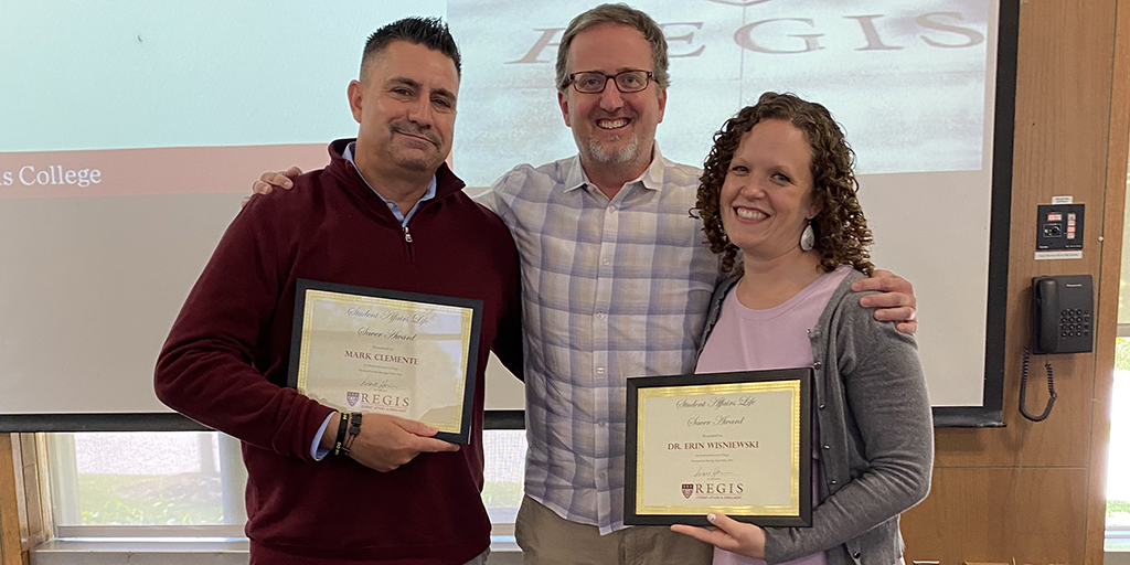 Associate AD Mark Clemente &amp; <a href="/RegisWBB/">Regis WBB</a> team mentor Dr. Erin Wisniewski received the Student Affairs Life Saver Award at Wednesday morning's divisional meeting for their commitment to enhancing student life at Regis. Congrats and thank you <a href="/MAnthonyClem/">Mark Clemente</a> &amp; @erinundy! #RoarPride