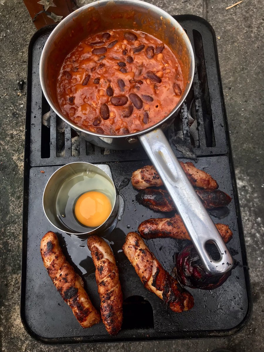 tantrictrevbbq's tweet photo. BBQ jacket spud plus pigs in blankets. Bbq pit beans with Nduja and blue cheese,red onion straight on the coals with honey, Fried egg and a little healthy salad lol. #weberGA #sausages #pitbeans #jacketpotato #nduja #homecooking #comfortfood https://t.co/7ZRZsxoPR1
