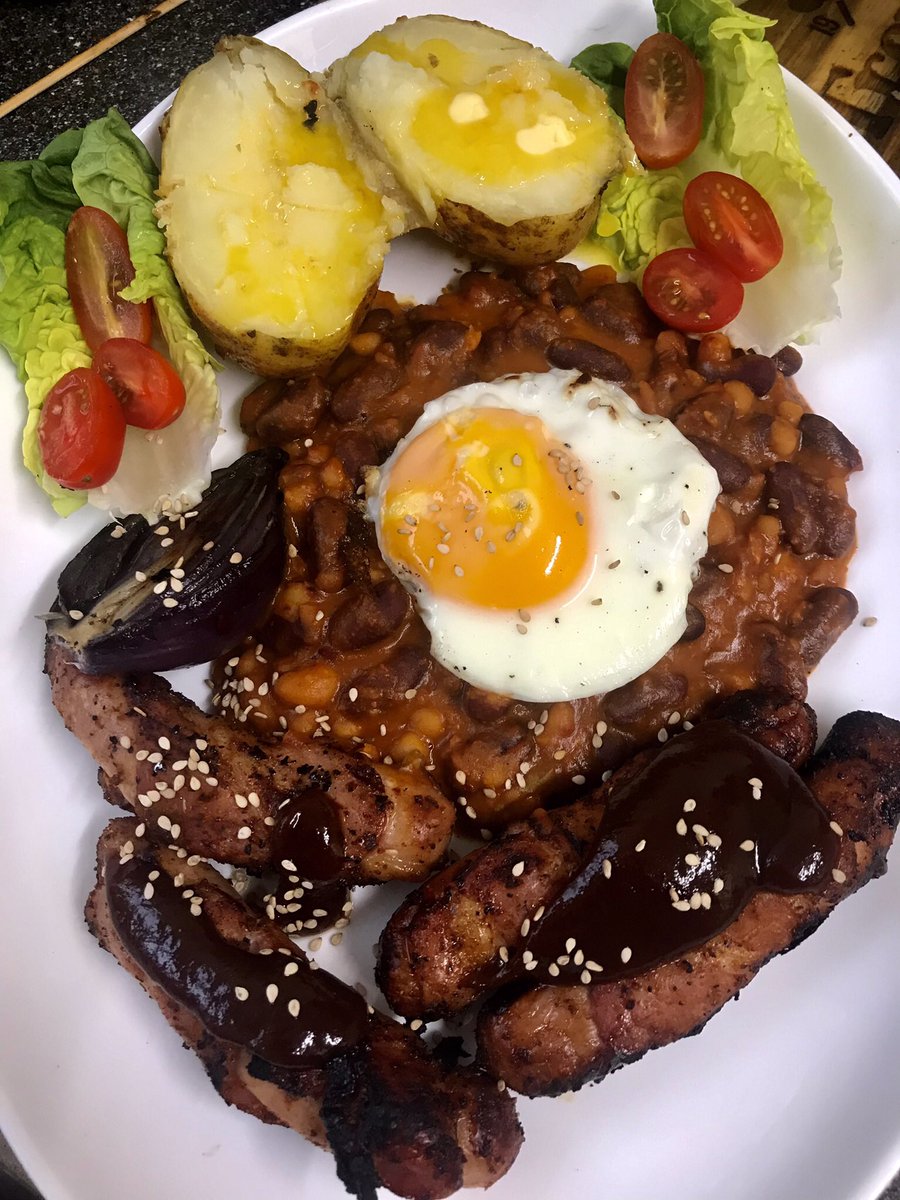 tantrictrevbbq's tweet photo. BBQ jacket spud plus pigs in blankets. Bbq pit beans with Nduja and blue cheese,red onion straight on the coals with honey, Fried egg and a little healthy salad lol. #weberGA #sausages #pitbeans #jacketpotato #nduja #homecooking #comfortfood https://t.co/7ZRZsxoPR1