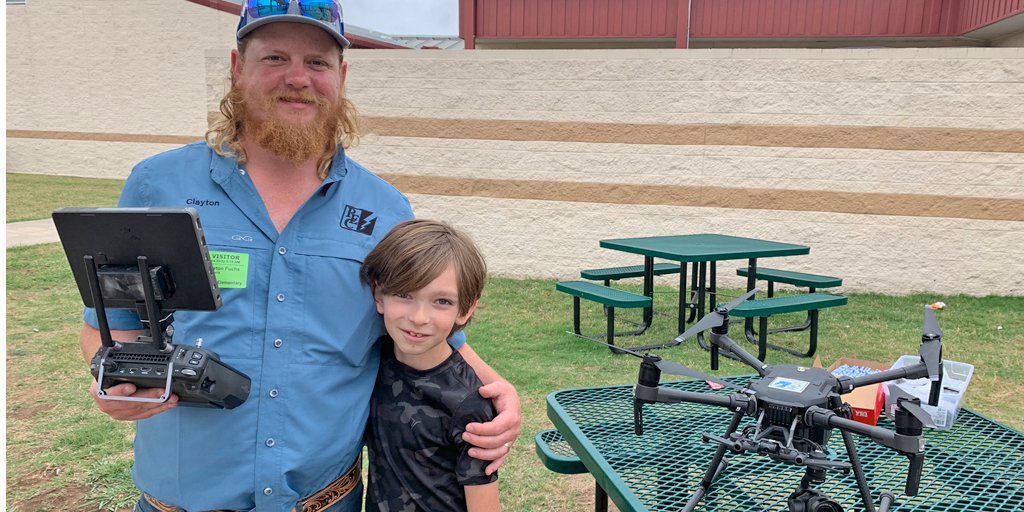 PedernalesCoop's tweet photo. PEC #lineworkers Clayton Fuchs and Joel Liebeskind shared their cool toys with the Rebecca Creek Elementary School students for #CareerDay. The students learned how #PEC uses unmanned aerial vehicles to detect issues with #powerlines. #PECstrong #PECproud https://t.co/bLVihx5JUi