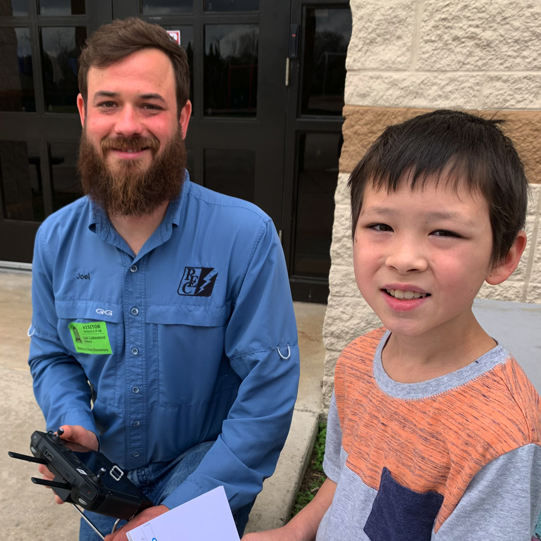 PedernalesCoop's tweet photo. PEC #lineworkers Clayton Fuchs and Joel Liebeskind shared their cool toys with the Rebecca Creek Elementary School students for #CareerDay. The students learned how #PEC uses unmanned aerial vehicles to detect issues with #powerlines. #PECstrong #PECproud https://t.co/bLVihx5JUi