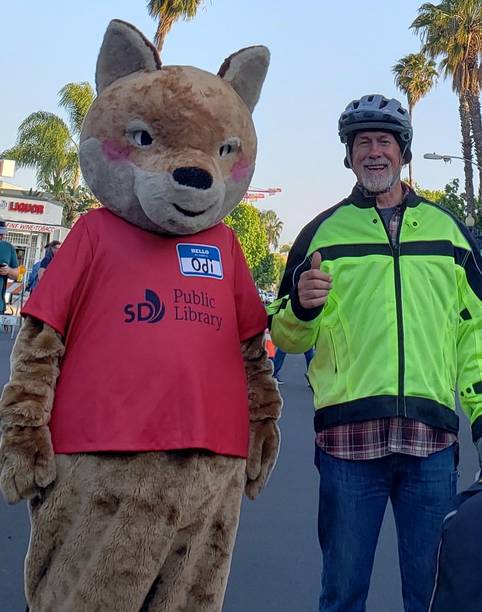 SDPublicLibrary's tweet photo. #OdiTheCoyote has been out and about throughout the community recently—check out last month's photos from the #UniversityHeights block party celebrating the 25th anniversary of their iconic sign. https://t.co/wSMjjTLqmW