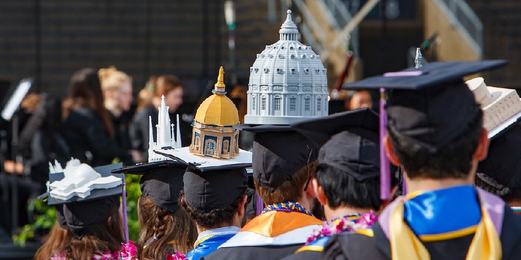 You always know when the <a href="/ND_Arch/">ND Architecture</a> graduates walk into Commencement 🎓

Each year, the #IrishArkies construct elaborate models on their mortarboard caps representing places that are important to them, inspire them, or show off their architectural design prowess.