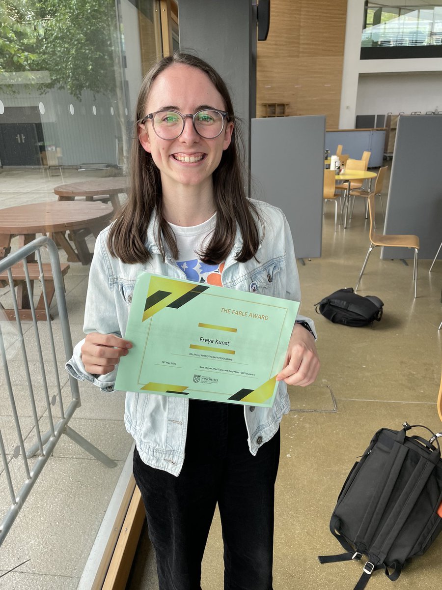 PhysioMand's tweet photo. @FreyaPhysio  collecting the "Fable award" , awarded to the student who goes above and beyond, just like #GuideDog did. Thank you @UoW_Physio students for creating this award to honour Fabes, she would be very proud @GuideDogsSW https://t.co/iu43hY36TA