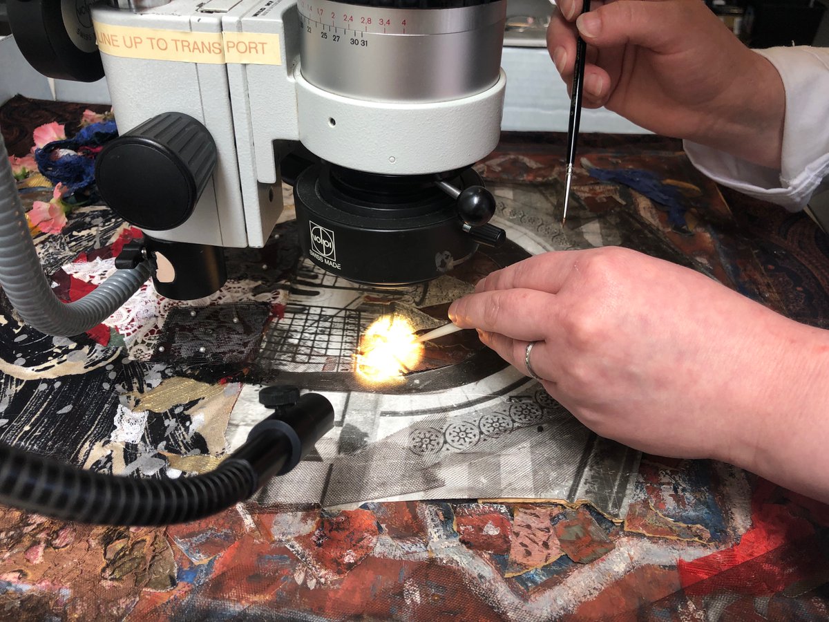 CCAHAconserve's tweet photo. Treating an artwork from @ZimmerliArtMuseum, #CCAHA Mellon Paper Conservation Fellow Joanna Hurd checks for flaking paint under a microscope and applies a cellulose-derived adhesive in ethanol to unstable areas. #paperconservation #artconservation https://t.co/kT0FxA3yGQ