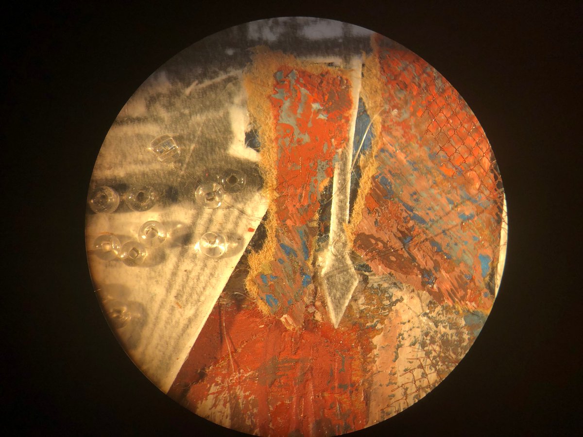 CCAHAconserve's tweet photo. Treating an artwork from @ZimmerliArtMuseum, #CCAHA Mellon Paper Conservation Fellow Joanna Hurd checks for flaking paint under a microscope and applies a cellulose-derived adhesive in ethanol to unstable areas. #paperconservation #artconservation https://t.co/kT0FxA3yGQ