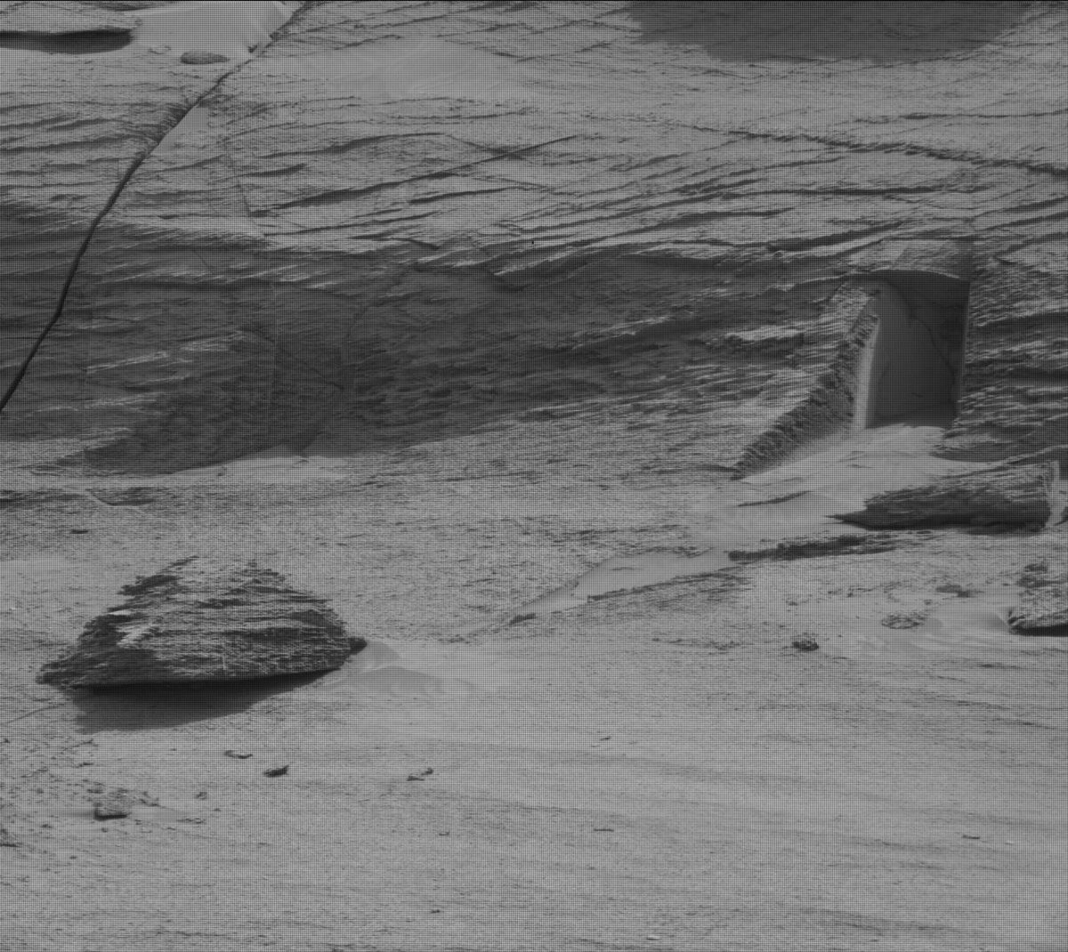 Some of you have noticed this image I took on Mars. Sure, it may look like a tiny door, but really, it’s a natural geologic feature! It may just *look* like a door because your mind is trying to make sense of the unknown. (This is called "pareidolia")  http://go.nasa.gov/3sGhC8l 