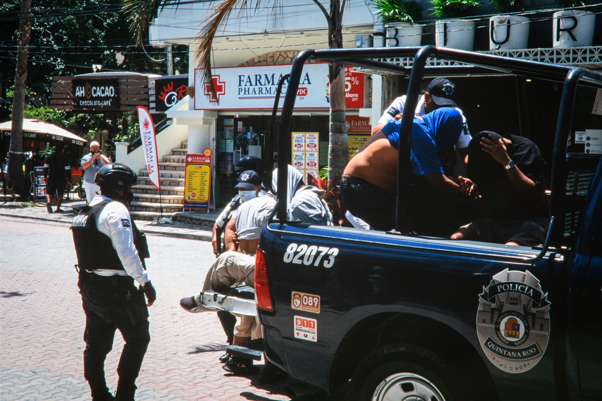 While in Playa del Carmen we took a taxi to the street market and inadvertently walked directly into a police raid. I shot these photos over my shoulder as we walked away from the scene #filmphotography #FujiSensia100 #35mmfilm