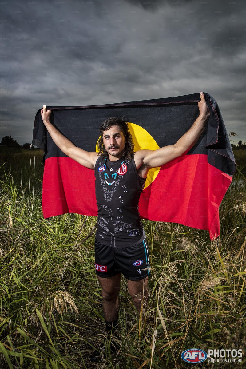 Designed by Lachie Jones with assistance from his aunty Madeliene Dirdi, <a href="/PAFC/">Port Adelaide FC</a>'s Indigenous guernsey celebrates his journey to discovering more about his Aboriginal heritage and the life and legacy of his grandmother.

#AFLDeadly