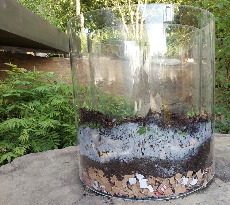 JulietSargeant's tweet photo. Ryan showing off his #wormery building skills for the #BluePeter garden @The_RHS #Chelsea! Made in clear acrylic so that children can watch the #worms turning waste food into #compost. Why not try composting at home? https://t.co/jbBHengPNE @YPTE @ProjGivingBack @Poppy_Talent https://t.co/UDX5Ium0Mu