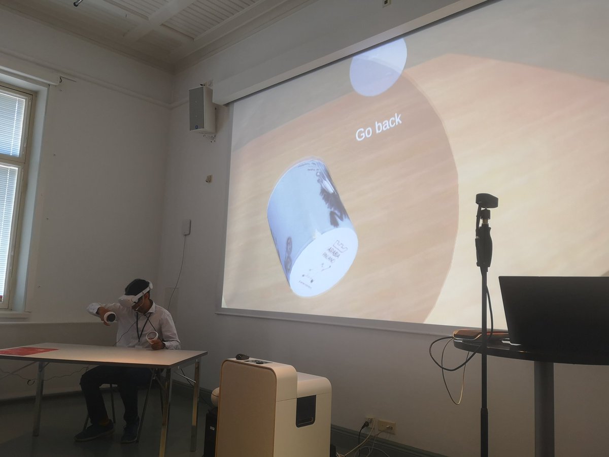 SpiceH2020's tweet photo. Gautam Vishwanath demonstrating the @SpiceH2020 VR pop up museum at today's seminar, which allows participants to add personal stories to objects, developed by @DesignmuseoFI and @AaltoUniversity
#CitizenCuration https://t.co/oBBCjXEY5q