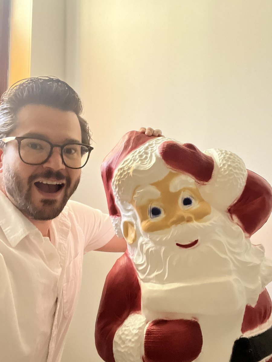 Couldn’t sleep early this morning so texted <a href="/dannynewman/">Danny Newman</a> about buying giant plastic santas in bulk and he wakes up this morning and sends me this. He has this in his living room people.