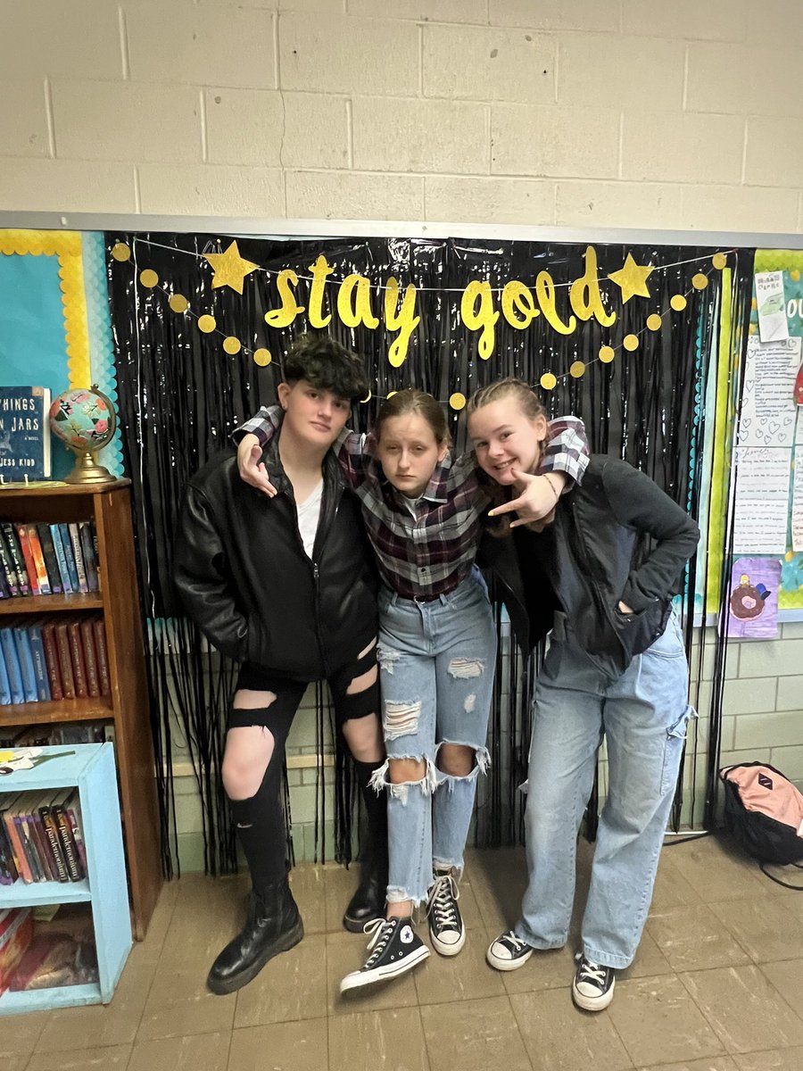 MrsRamicone's tweet photo. A few well dressed Greasers and Socs from this morning. We enjoyed Ponyboy’s favorite soda (Pepsi) and Sodapop’s chocolate cake, and played Outsiders Bingo. What a blast! https://t.co/vIw5UJw3lz