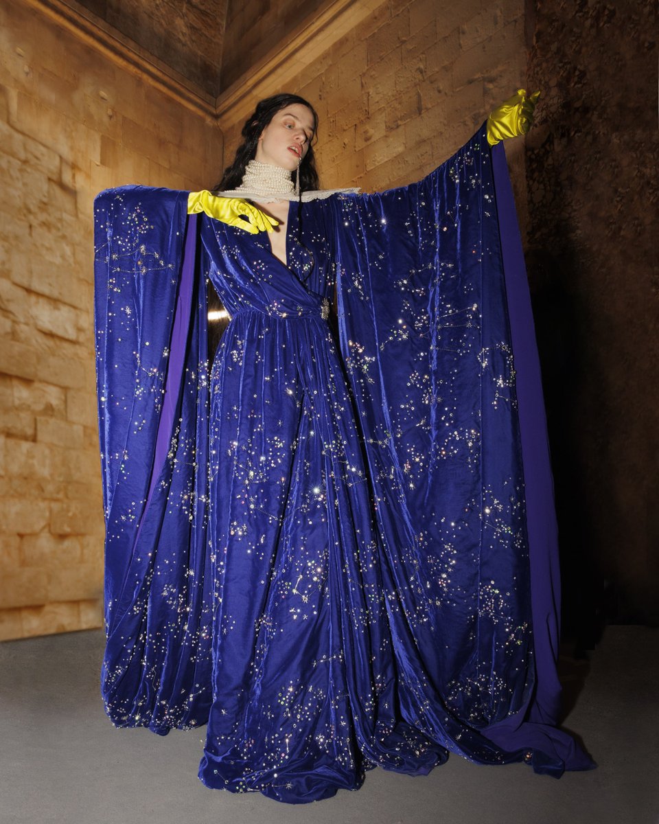 Captured backstage at the #GucciCosmogonie fashion show, the finale look is illuminated by crystal constellations, becoming an ode to the cosmos, as well as the assemblage aesthetic of #AlessandroMichele.