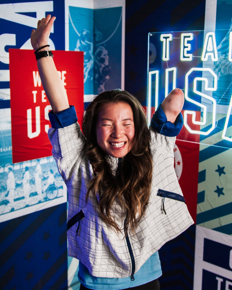 grace miller poses in front of a team usa backdrop