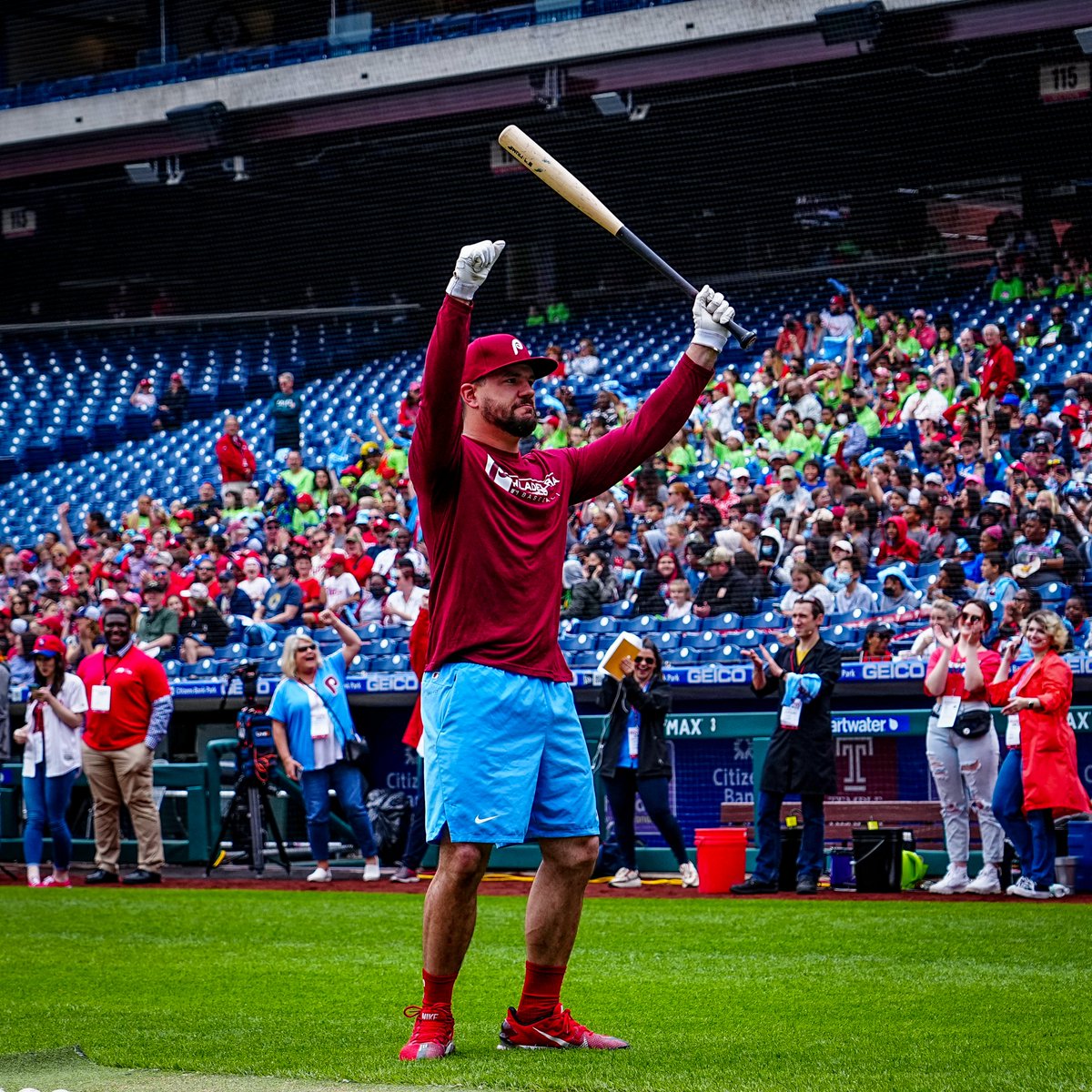 Kyle Schwarber celebrates with his bat after a successful weather education experiment. 
