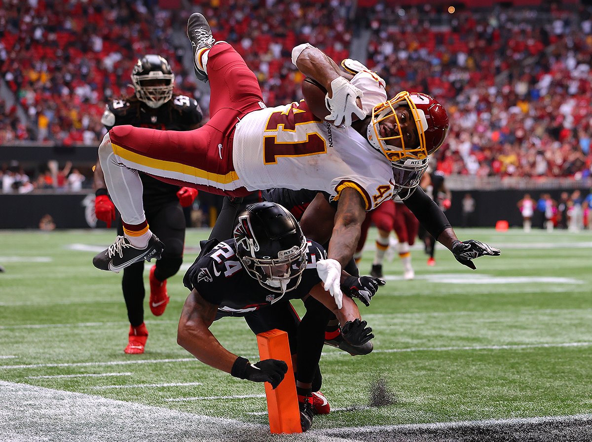 Kevin Cox’s airborne shot of <a href="/JdMckissic/">Jd Mckissic</a>, entitled “A Commanding High Jump For The W”, earns an Honorable Mention in the Hall of Fame’s annual Photo Contest.