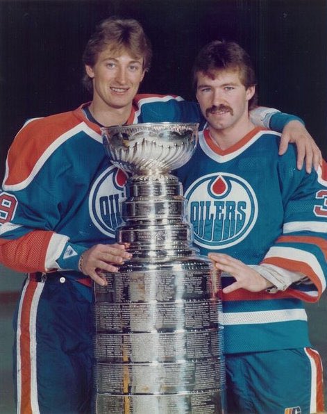 mandazanier's tweet photo. 38 years ago today you won the Stanley Cup! 

Dad, because you started playing hockey I am today living my dream writing about it! 

Congrats to you @MikeZanier on this special day! 💙🧡 https://t.co/3dPla7UChO