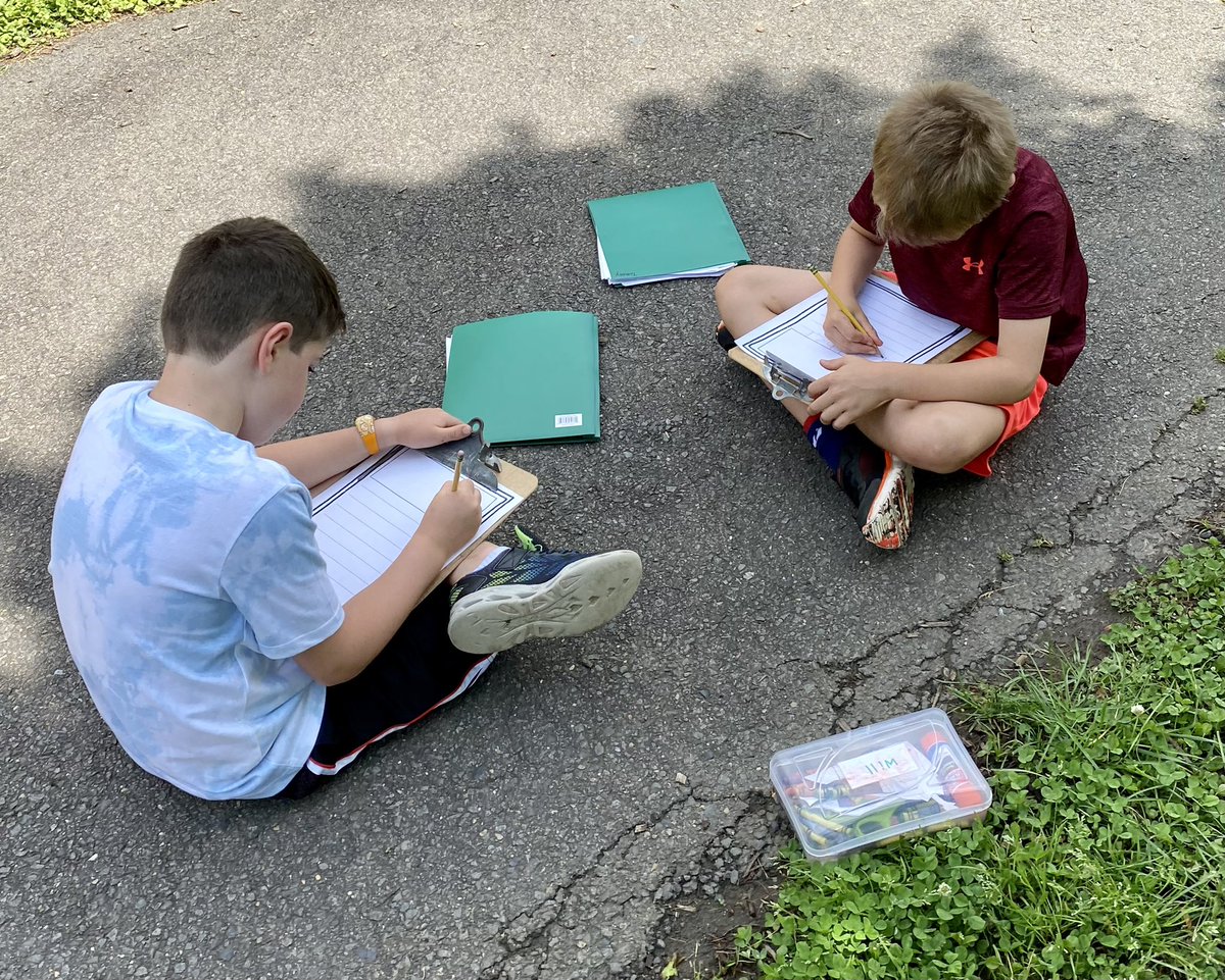 Writing our fiction stories outside and enjoying the weather. ☀️✏️